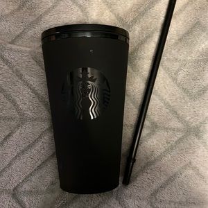 Matte black with green interior Starbucks cup.